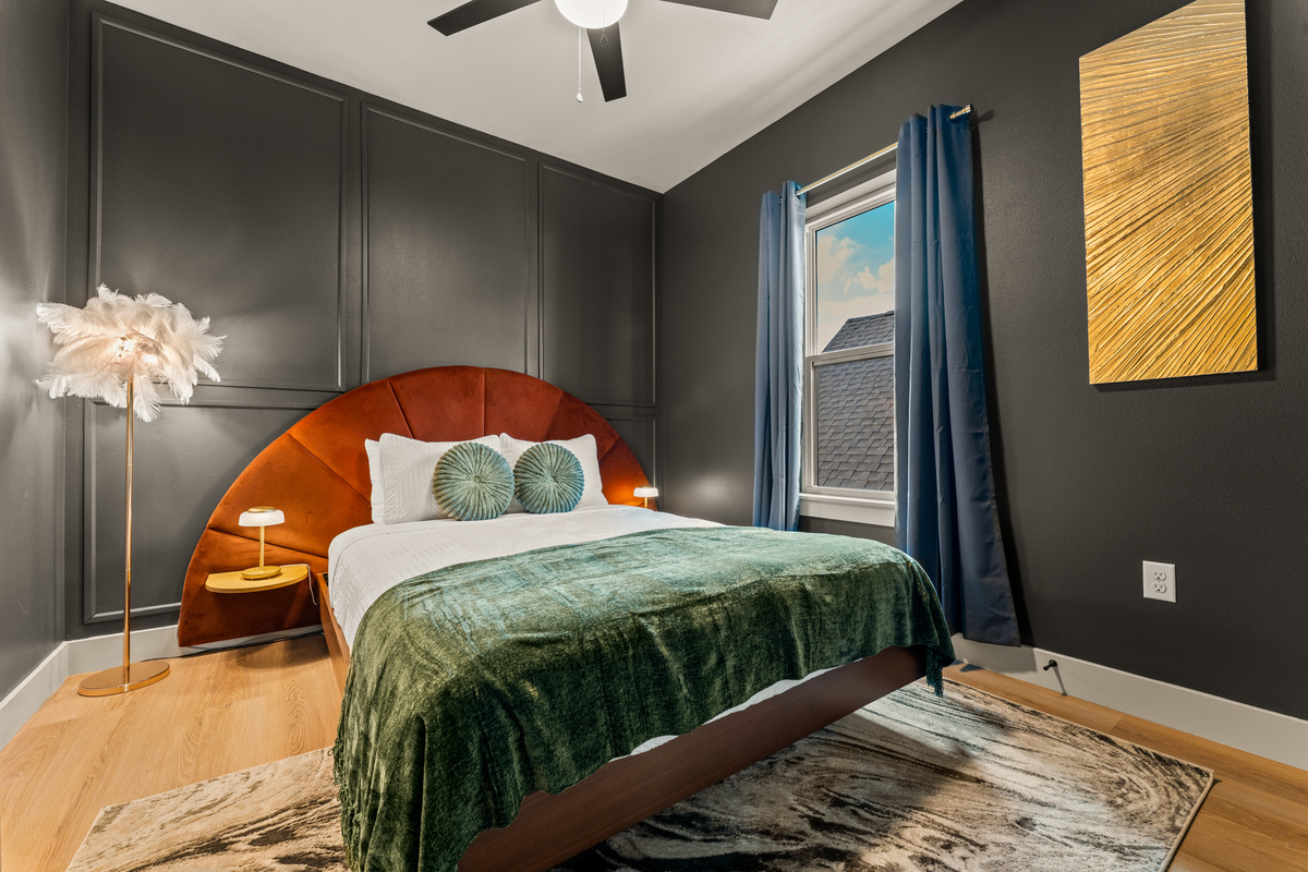 Bedroom: Cozy king bedroom with rich colors, stylish finishes, and plenty of natural light.