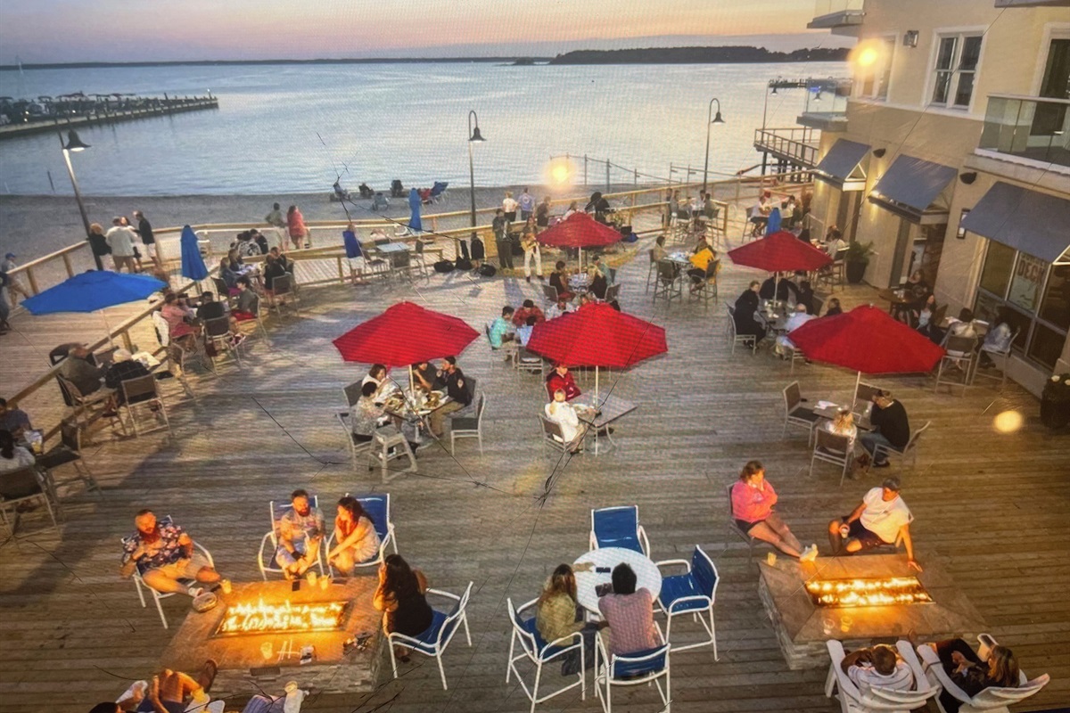 Boardwalk with firepits overlooking bay