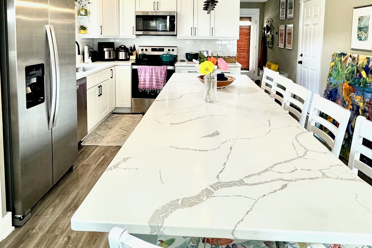 Counter extension with extra dining and work spaceSix padded counter stools