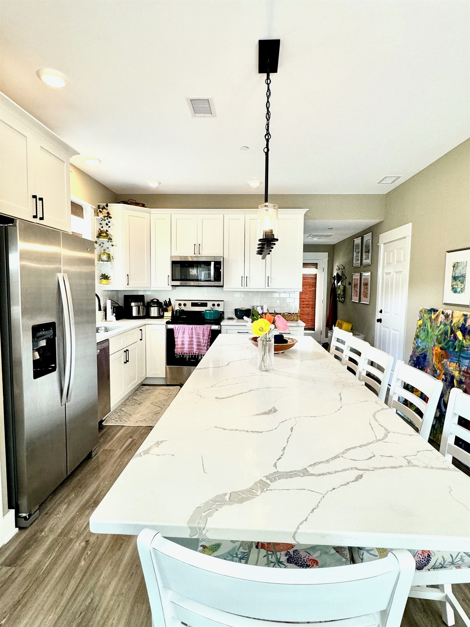 Counter extension with extra dining and work spaceSix padded counter stools