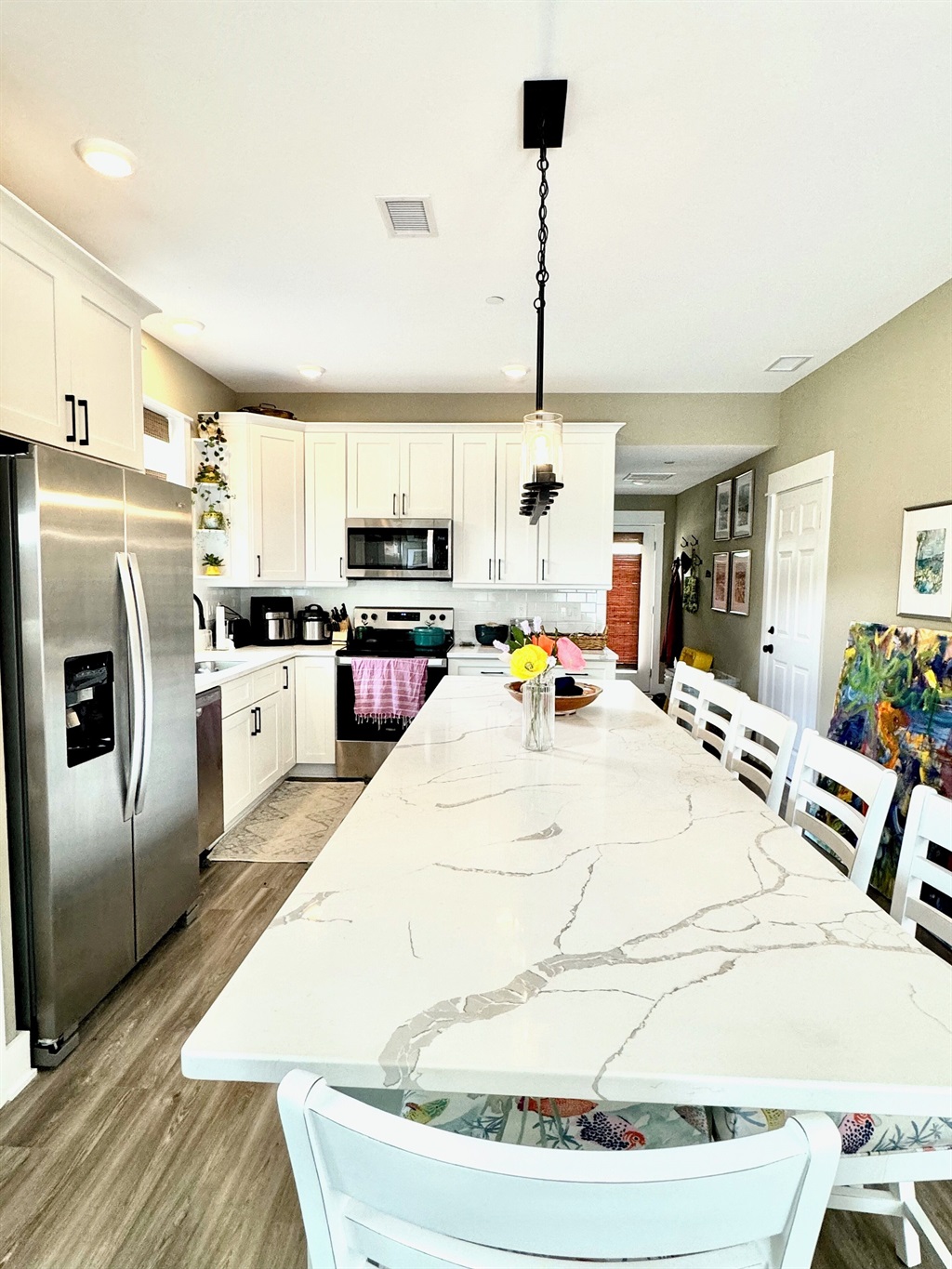 Counter extension with extra dining and work spaceSix padded counter stools