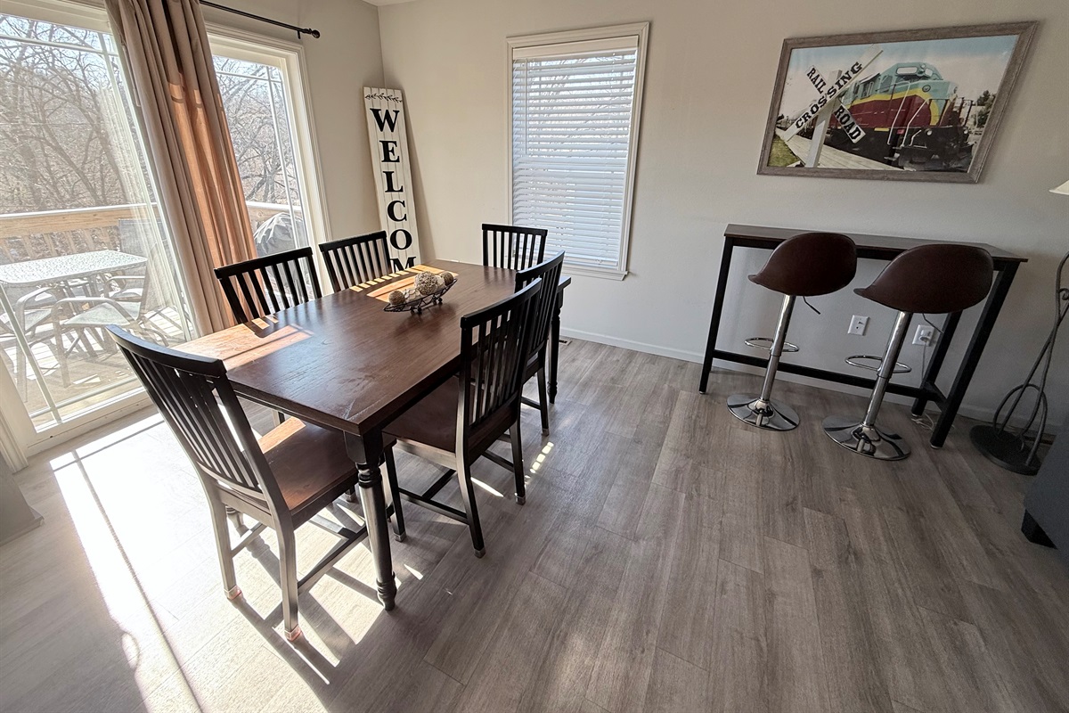 Dining area overlooks outside deck