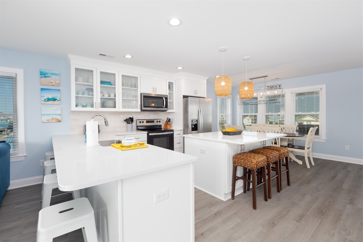 Fully equipped kitchen with refrigerator, microwave, and stovetop.