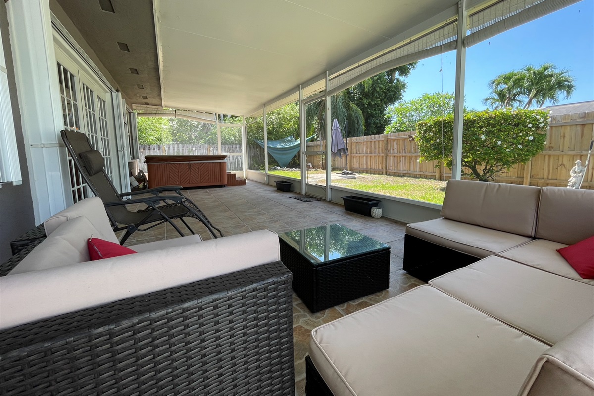 The sunroom is a great way to stay out of the heat while still enjoying all the green space.