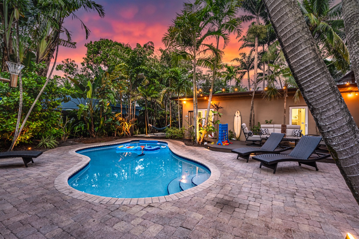 Welcome to your own tropical playground — heated salt pool, outdoor bar, and palm-lit nights made for unforgettable hangs 🌴