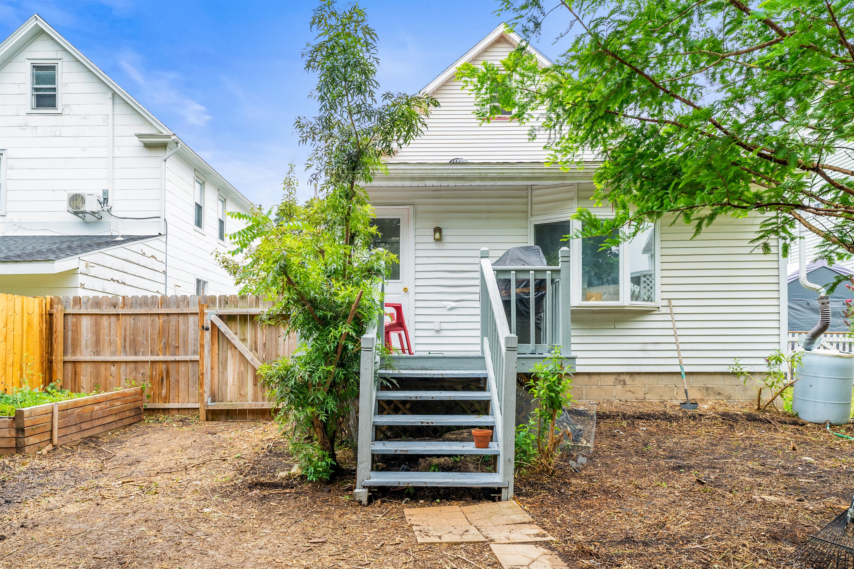 Step out from the back door to newly graded yard and grill area—your own urban escape!