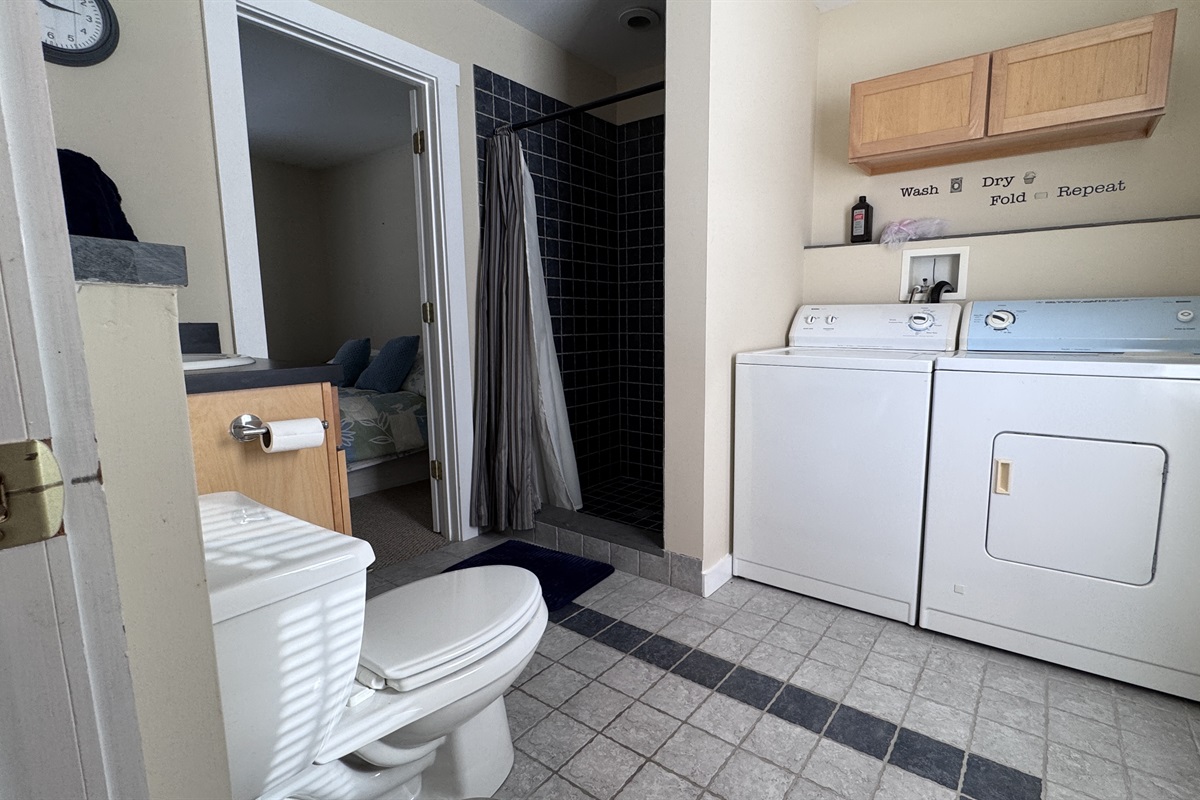 First-floor bathroom with washer and dryer