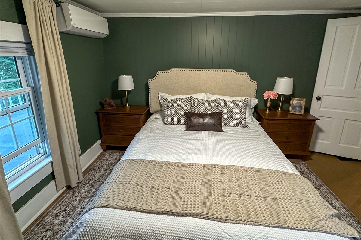 Retreat to a cozy, elevated escape where rich green walls, warm wood tones, and crisp white bedding create the perfect blend of comfort and style. We keep all of our beds dressed in fresh white linens so you can instantly see everything is sparkling clean.