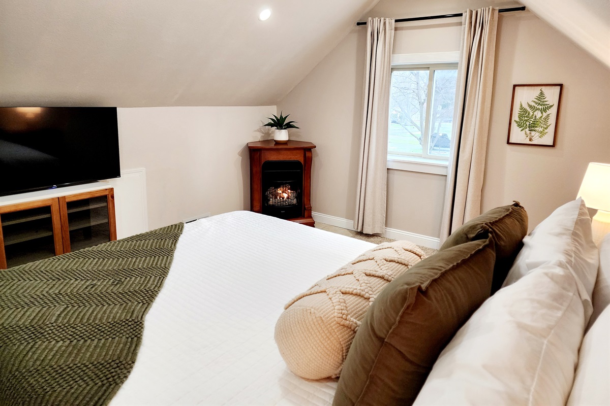 Cuddle up in bed to watch a movie while in your private master bedroom. 