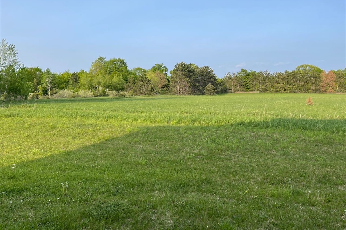 View of path from private back patio. This walking path leads to Twin Lakes Park/ Beach area.