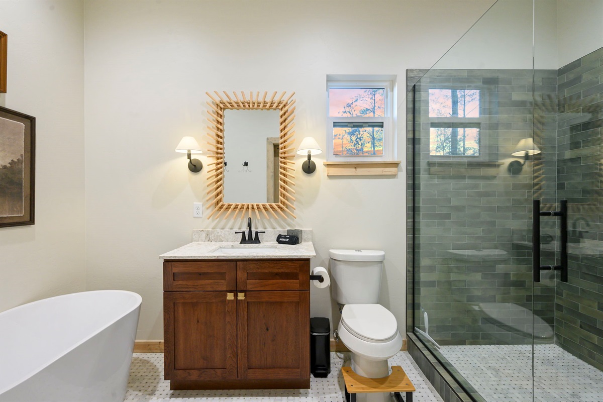 Downstairs king en-suite. Soaker tub and oversized shower to relax after long days our exploring. 