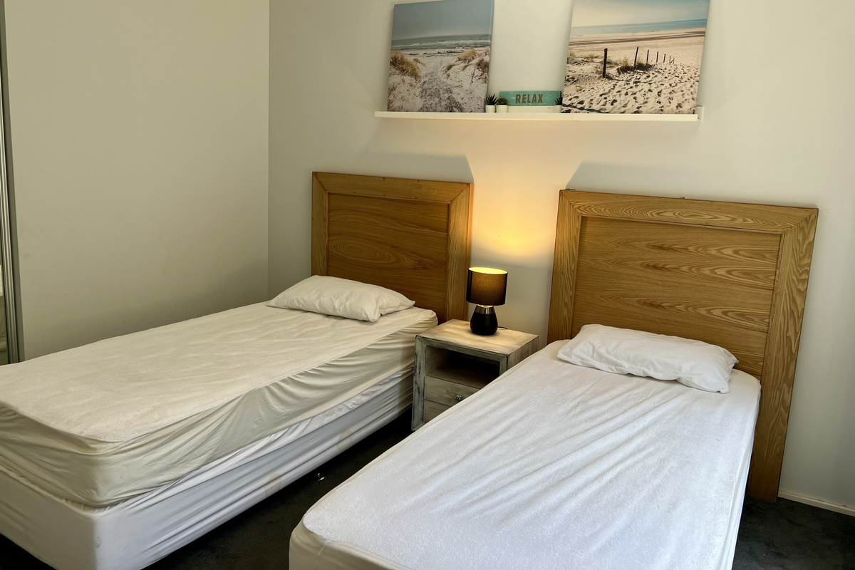 Bedroom Three with 2 single beds & built-in robe