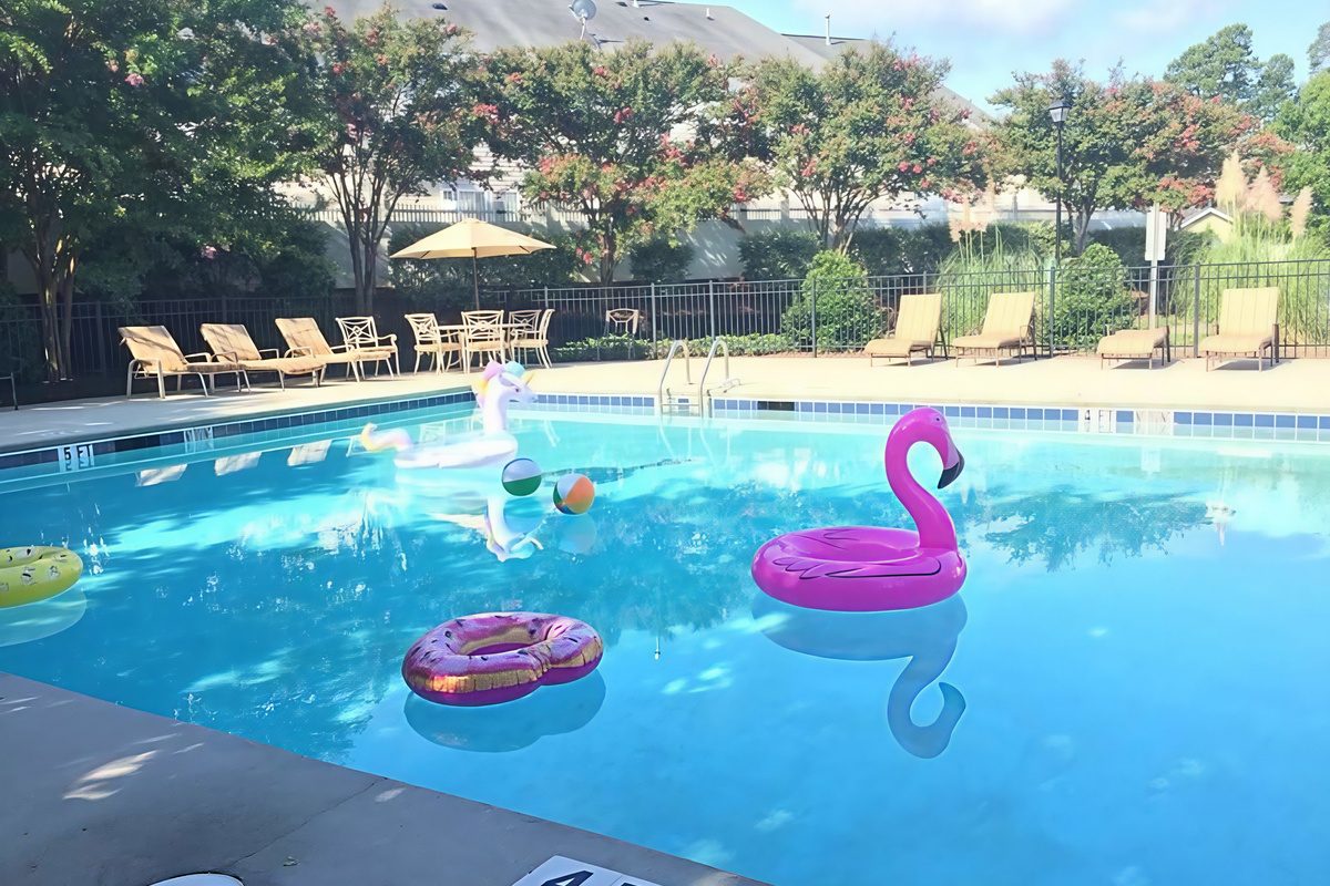 Gated Community Pool with Bathrooms across the street. 1 min walking distance