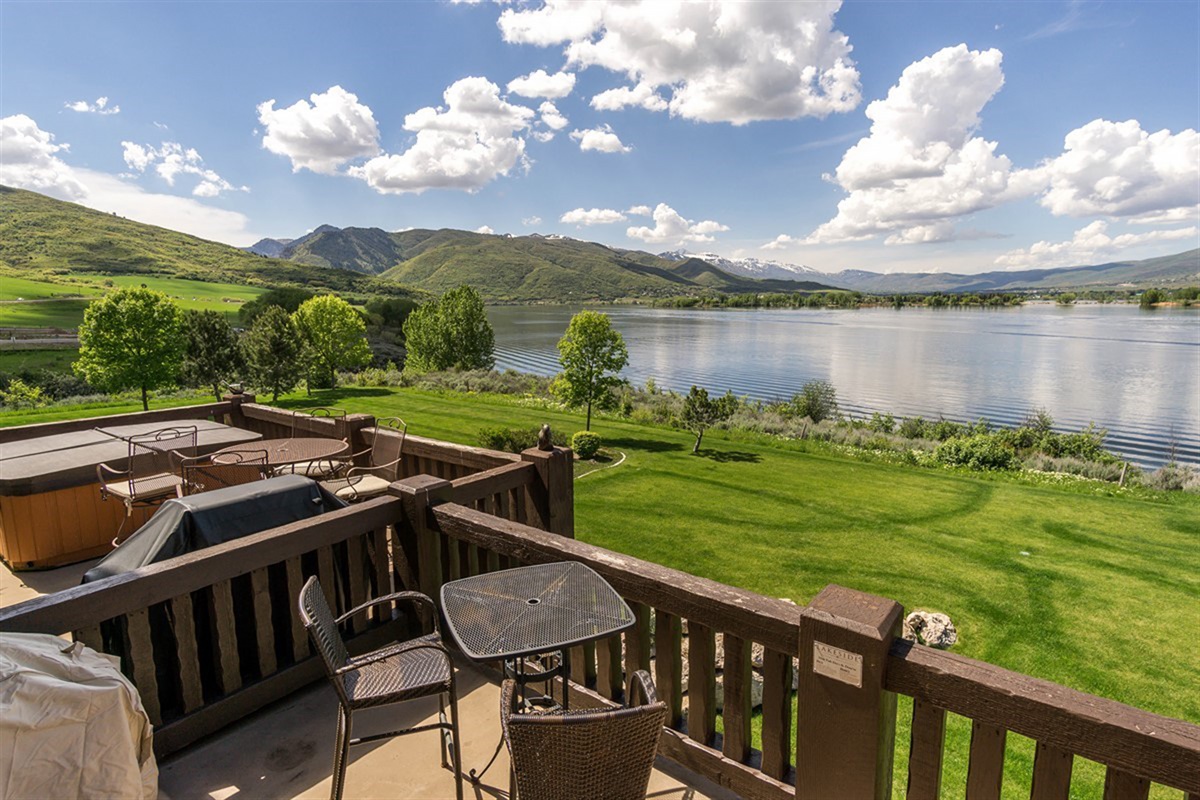 Step onto a private deck overlooking Pineview Reservoir—where sweeping lake views and fresh mountain air create an unforgettable outdoor experience.