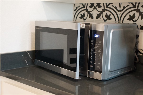 Microwave in the kitchenette for easy reheating and simple meal preparation.