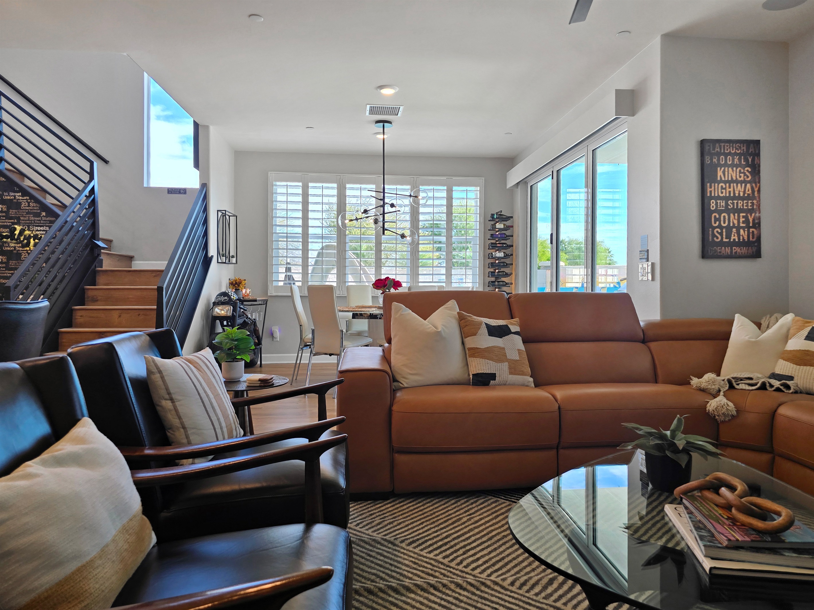Seamless transition from the living room to the backyard, where expansive natural light enhances the home’s open, airy feel.
