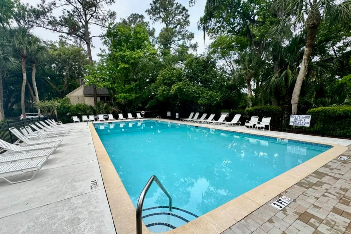 Community pool with lounge chairs