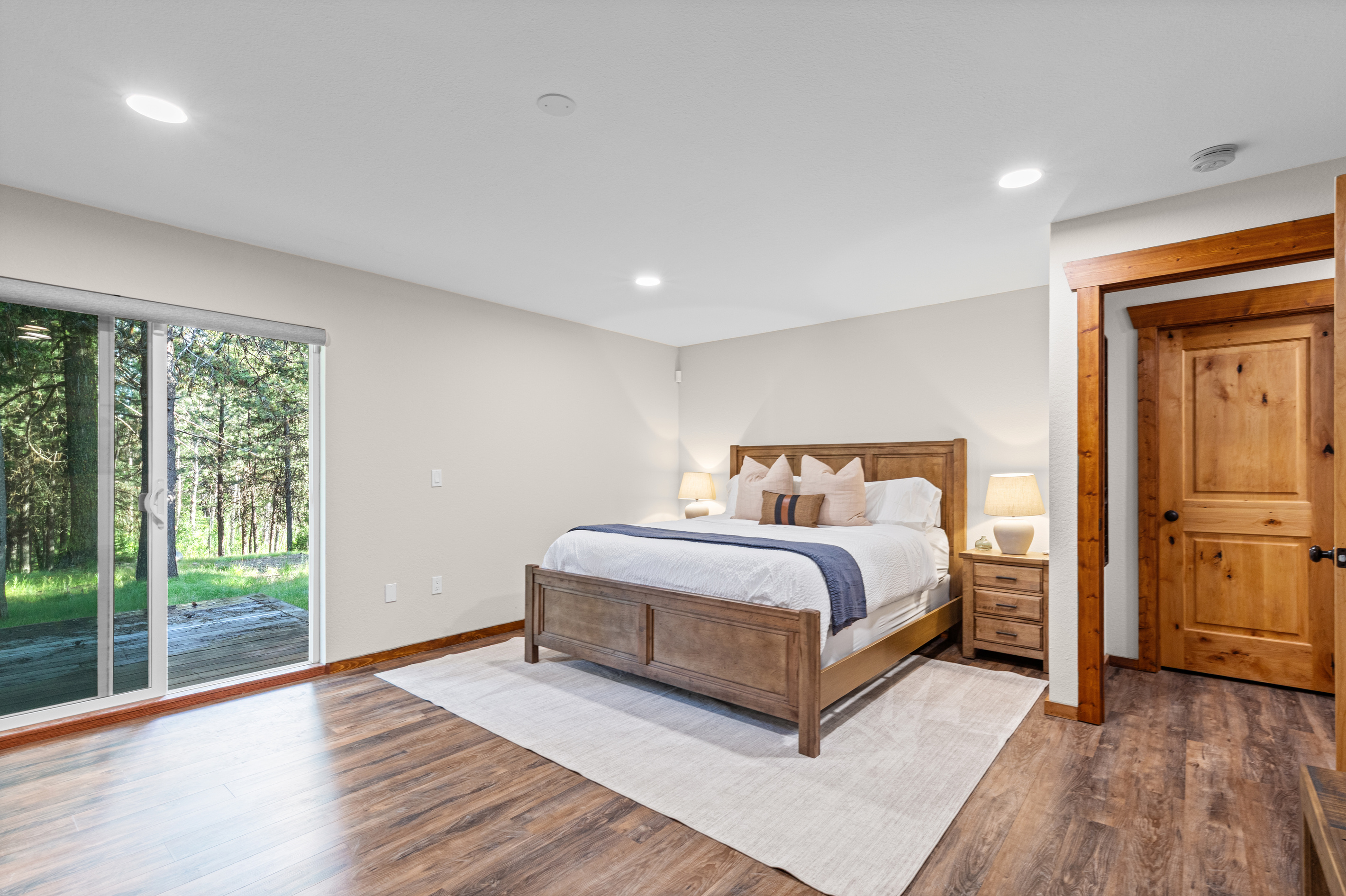Primary Bedroom with California King Bed, nightstands and closet