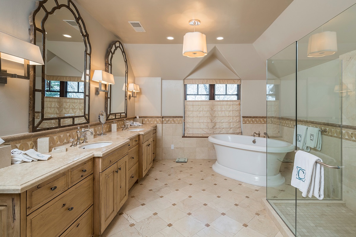 BR 1- En Suite Bath with dual vanities, glass shower, separate tub