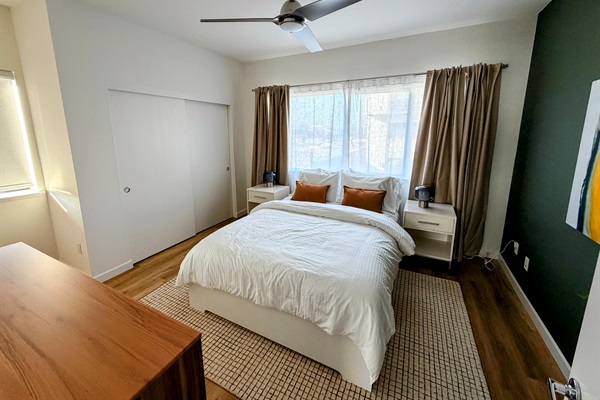 Primary bedroom with queen bed.