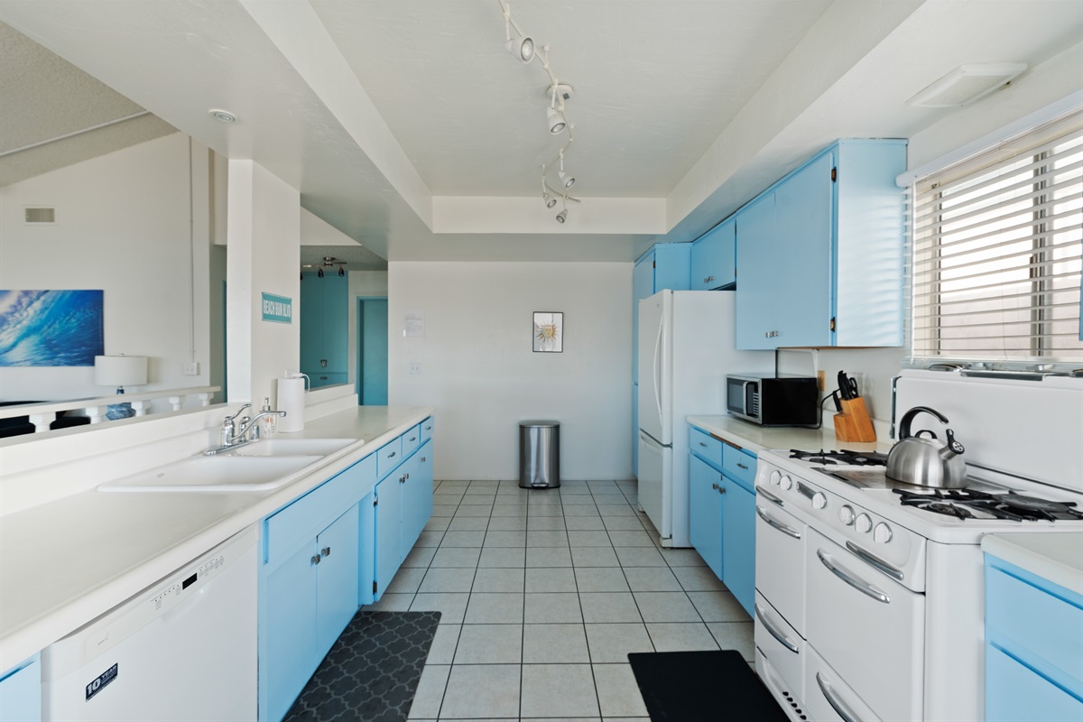 Fully equipped kitchen with vintage blue cabinetry and full-size appliances