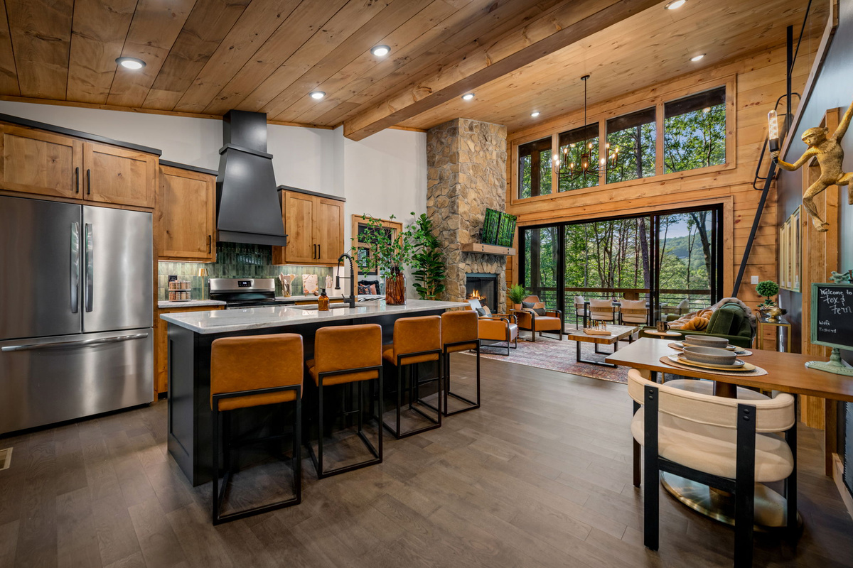 Open concept living space with vaulted ceiling