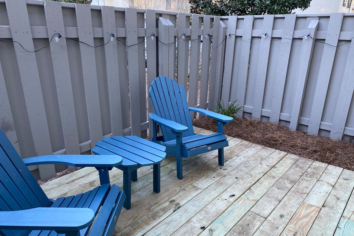 Private patio with Adirondack chairs