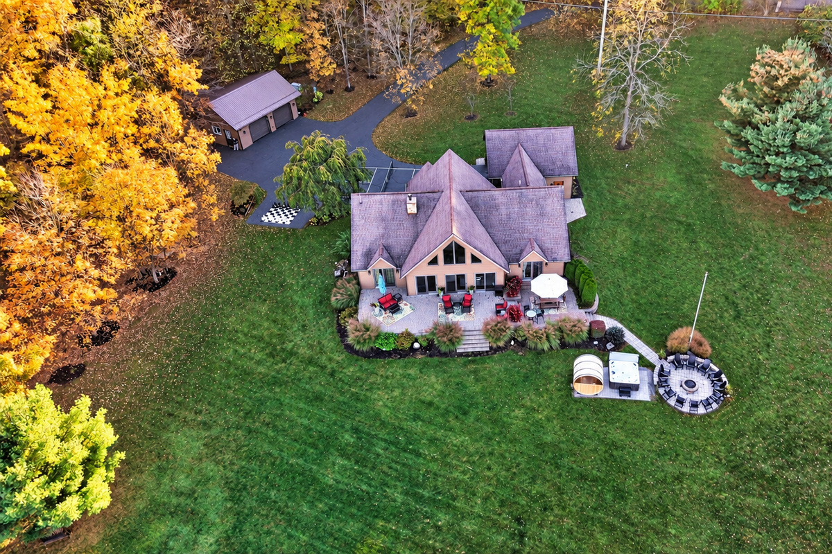 Rear aerial view showing patio and lawn