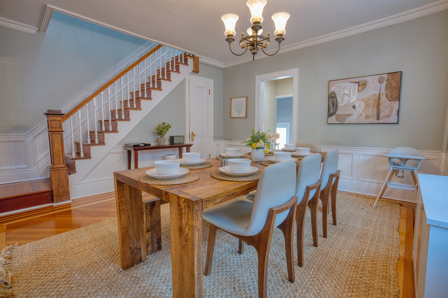 Solid wood dining table with seating for the whole group, and the baby.