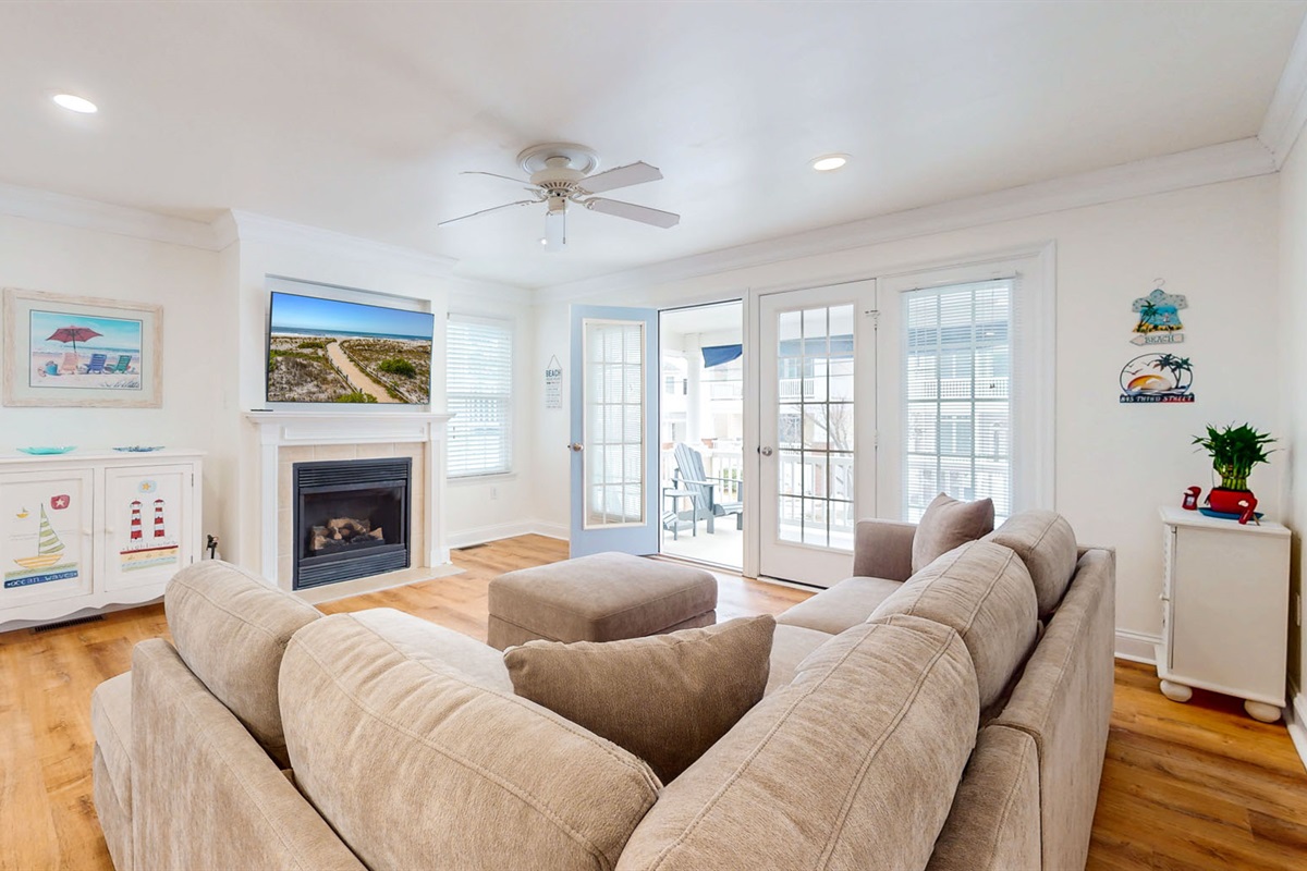 Living room area with fireplace and a flatscreen TV