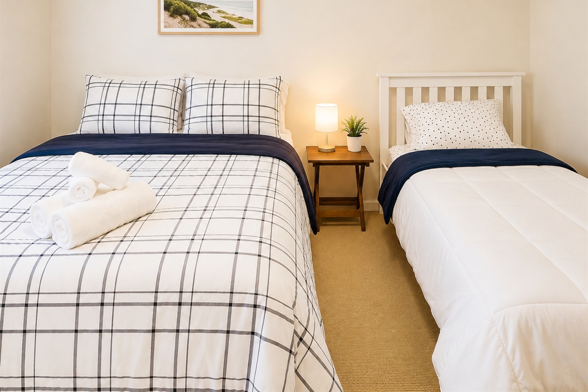 inviting and comfortable bedroom with a Queen size bed and a Twin bed