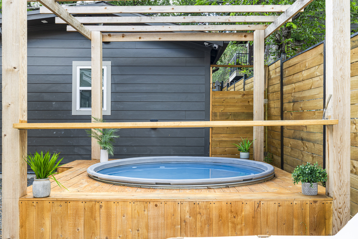 Two ways to unwind: a cowboy pool and a hot tub.