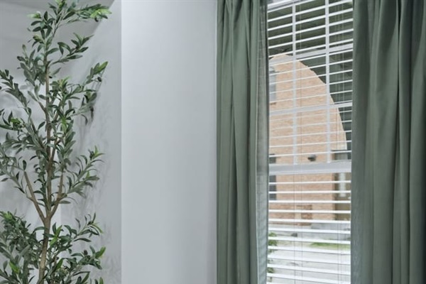 Cozy reading corner with a comfortable accent chair and natural light from the nearby window—perfect for a quiet moment with coffee or a book.
