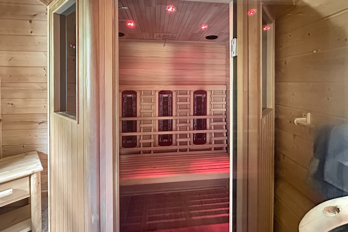 Sauna Retreat: Unwind in a serene wood-paneled sanctuary with soothing red lights!