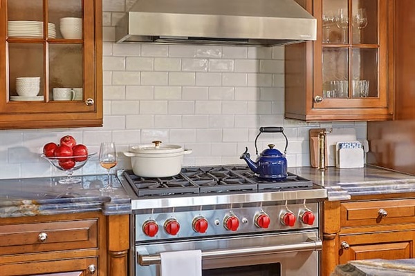 A six-burner Wolf gas range—perfect for preparing gourmet meals with ease and precision.