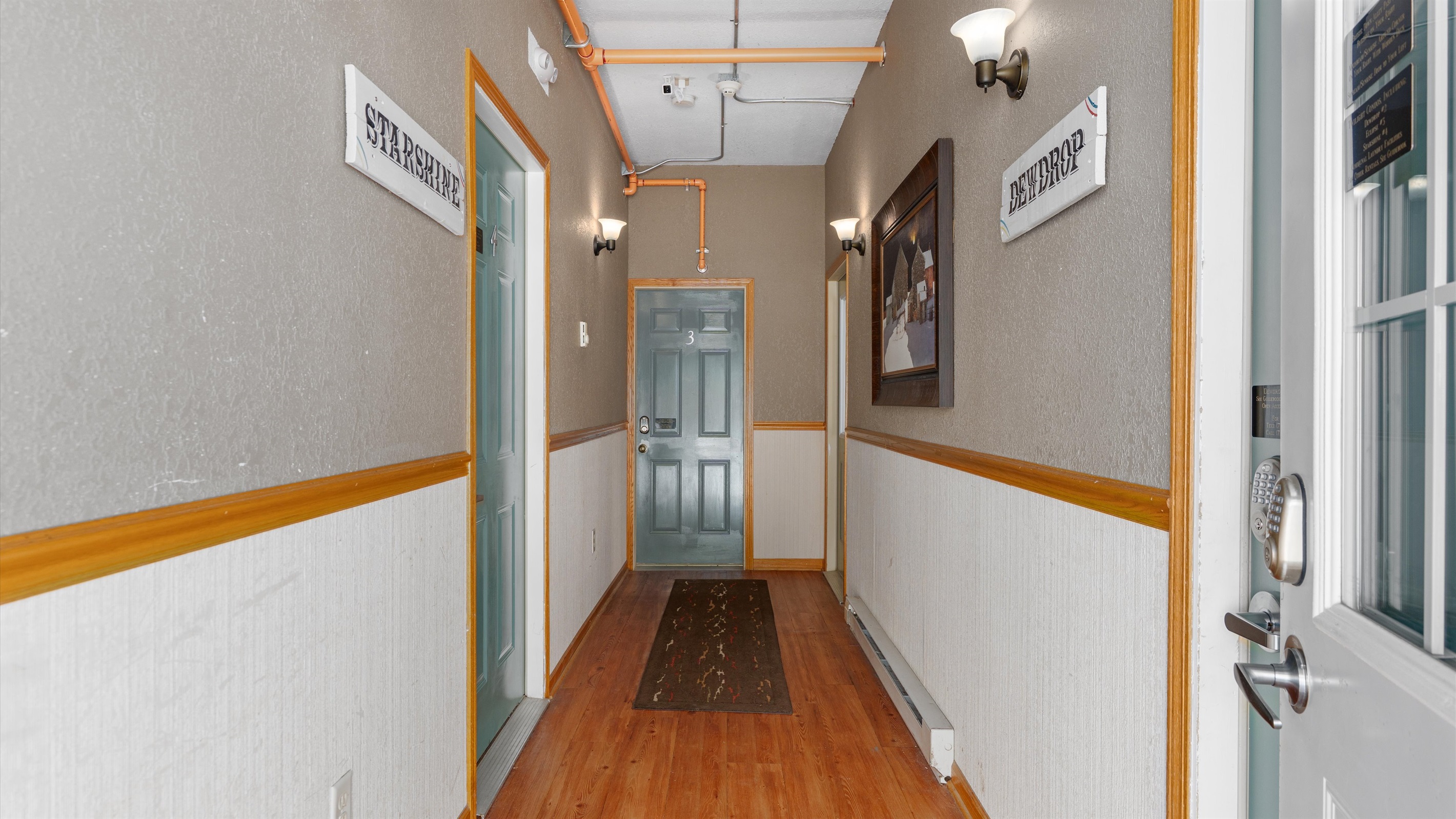 The entrance to Dewdrop is immediately to the right after entering the shared building hallway. 