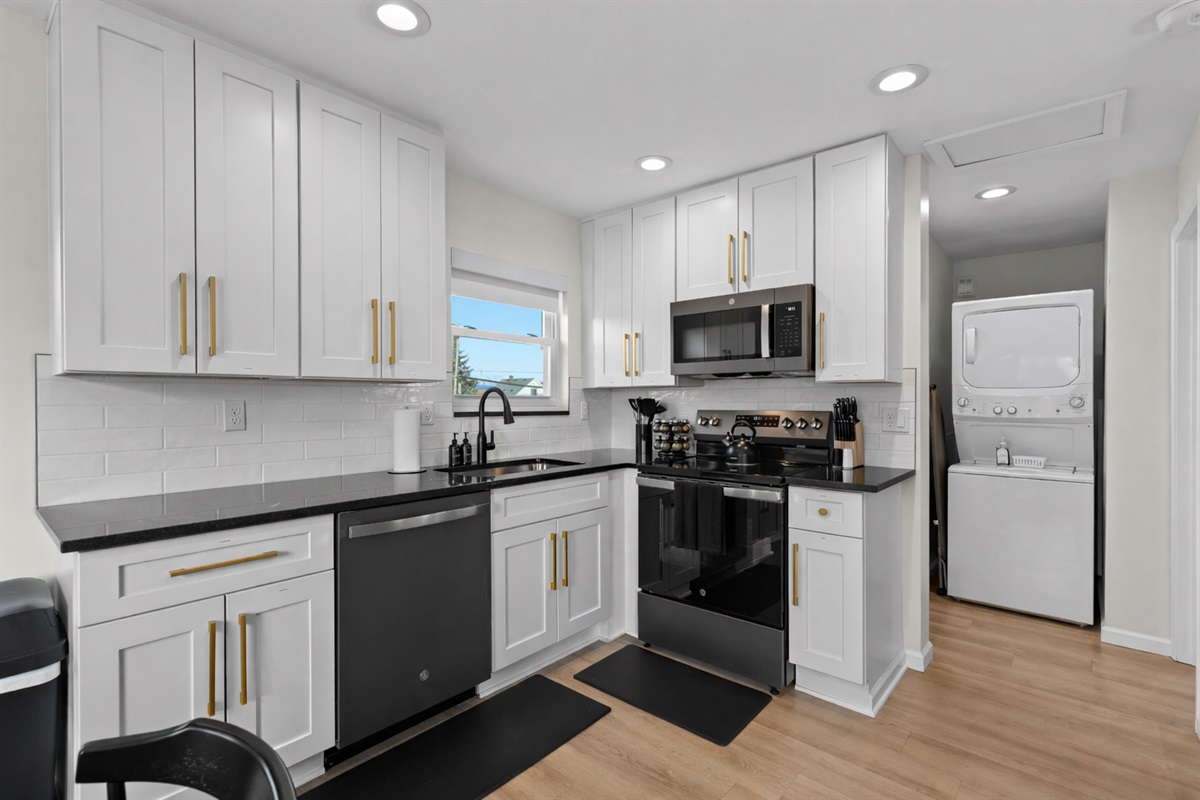 Bright, modern kitchen with full-size appliances, ample cabinetry, and clean finishes—perfect for cooking, meal prep, and comfortable everyday stays.
