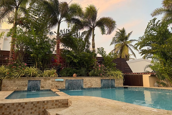 Private Pool With Seating and Waterfall for cooling off.
