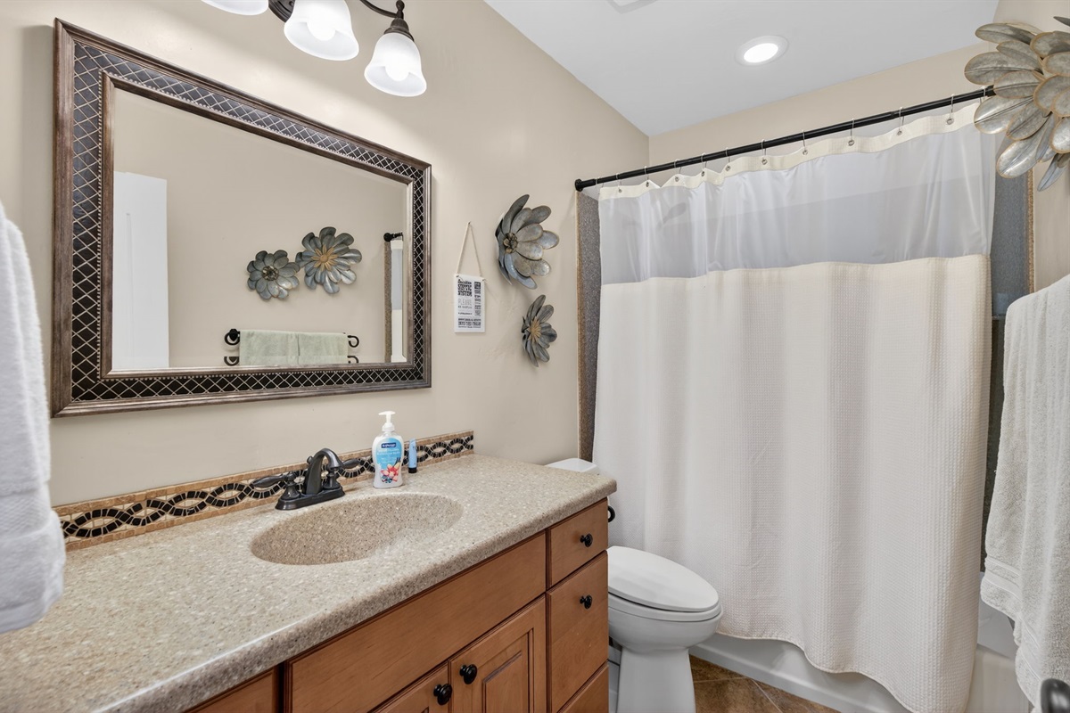 Basement full bathroom adds extra convenience for guests staying on the lower level