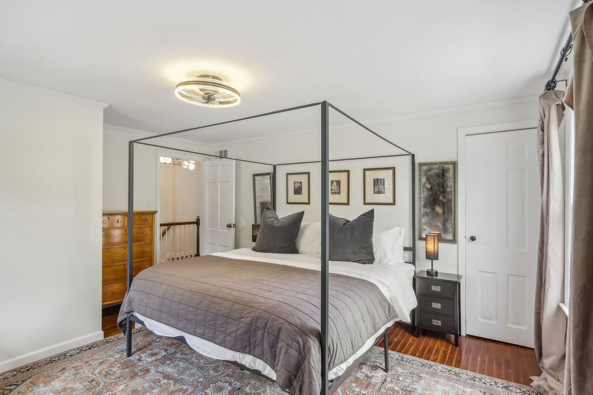 Unwind in the primary suite with a luxurious king-size bed, soft sheets, and cozy bedding designed for a restful stay.