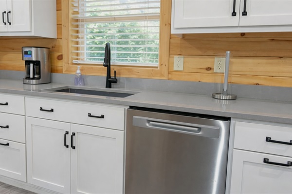 This kitchen features brand new appliances and is stocked for your every need for morning pancakes, afternoon cocktails, or evening family dinners