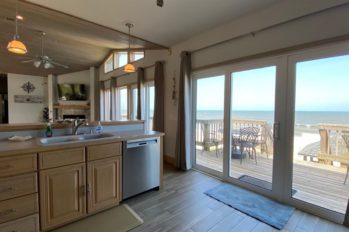 Kitchen overlooking deck and family room