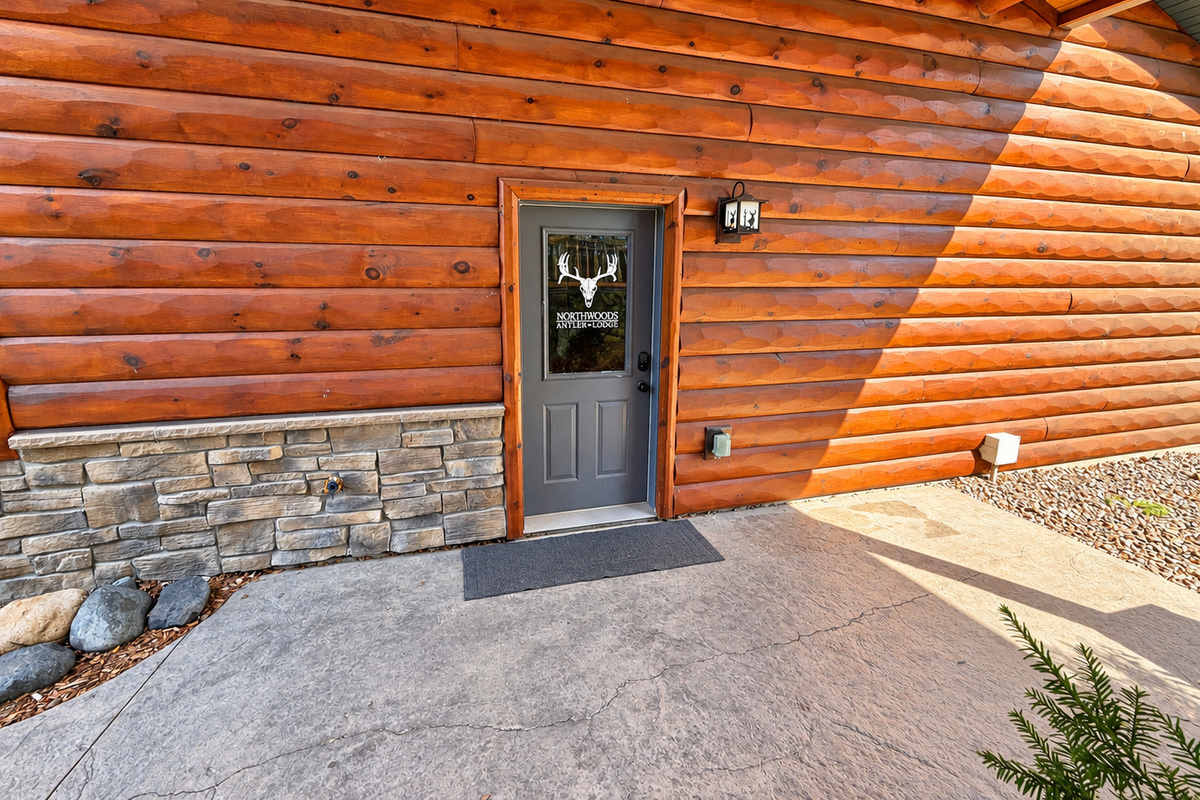 Enjoy easy, secure arrival with smart-lock access. This entrance provides convenient entry into Northwoods Antler Lodge and direct access to the attached garage.