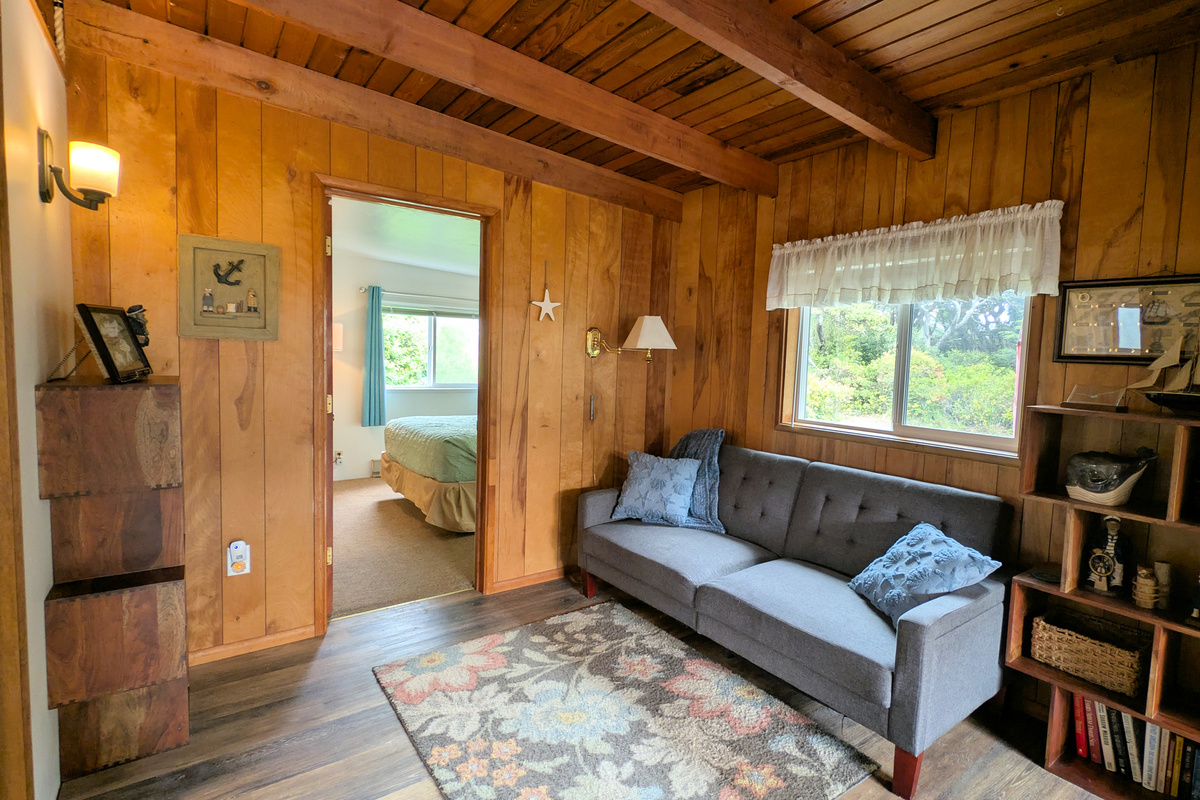 Bonus room with fold flat/click-clack sofa on way to primary bedroom