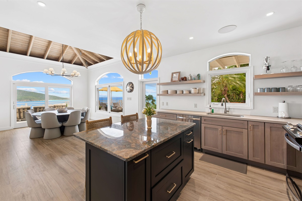 Fully stocked kitchen with stainless appliances, bar seating, coffee maker, blender, and all the tools to cook or sip in style. Enjoy free Wi-Fi throughout the villa.