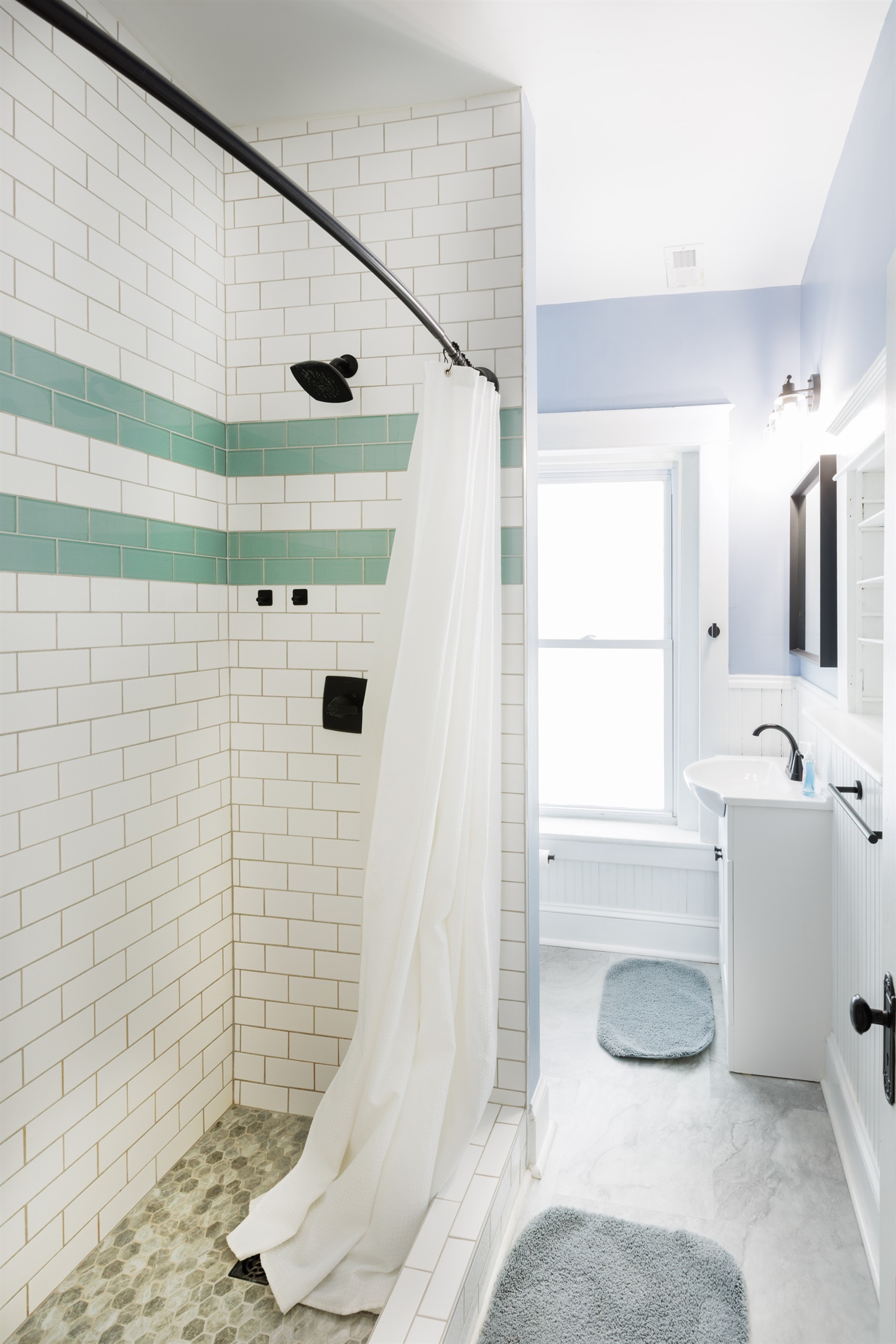 Peaceful and private space with modern fixtures. 2nd floor Full bathroom includes toilet, sink, and shower.