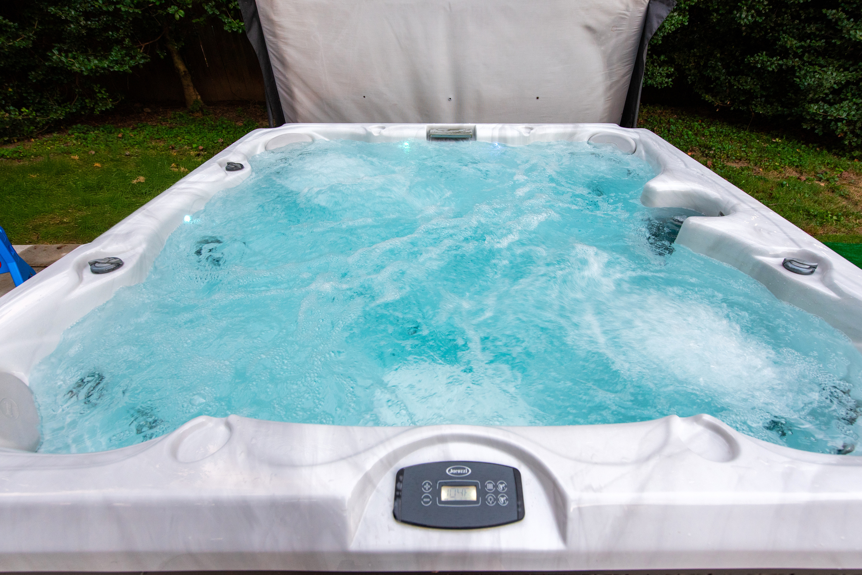 Hot tub, fire pit and back deck area