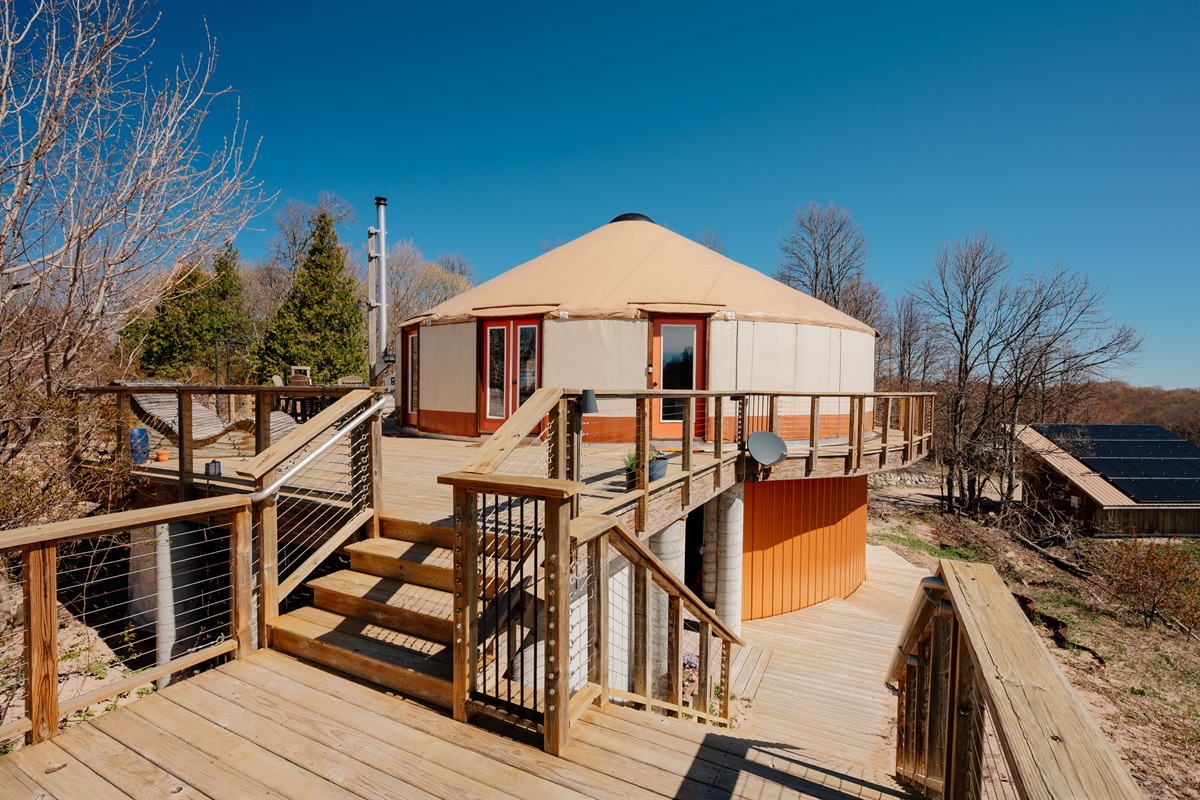 Unique luxury yurt nestled among the dunes, featuring expansive decking, panoramic views, and an unforgettable glamping experience.
