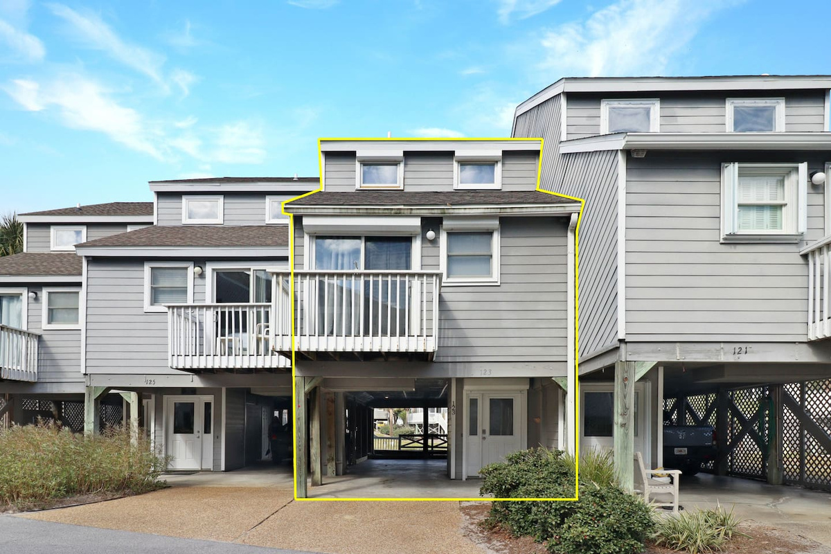 Pull straight into the covered carport and unload the car in the shade &mdash; 123 Sabal has room for two vehicles.