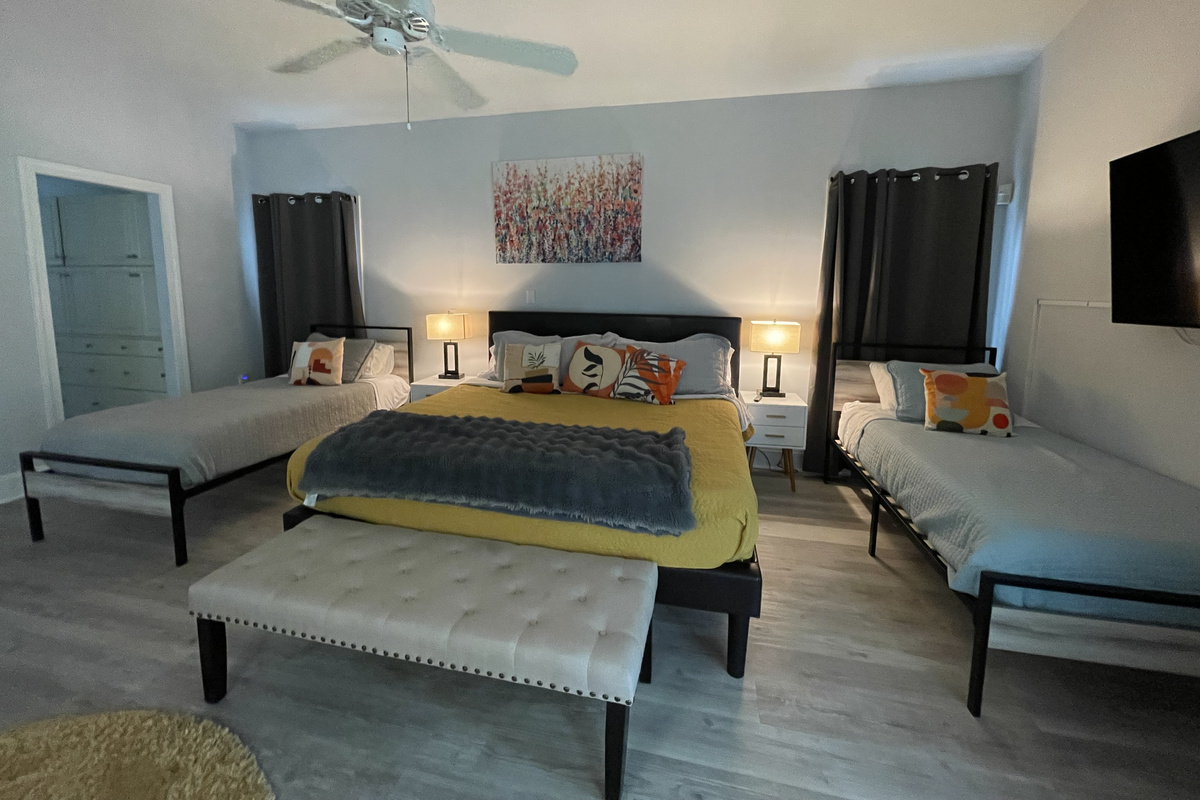 Master bedroom with 1 king bed and 2 twin beds